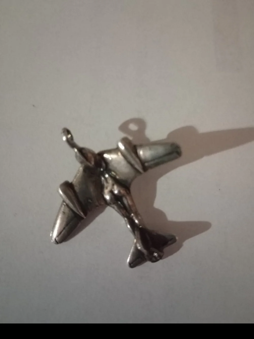 Silver female bodied plane pendant